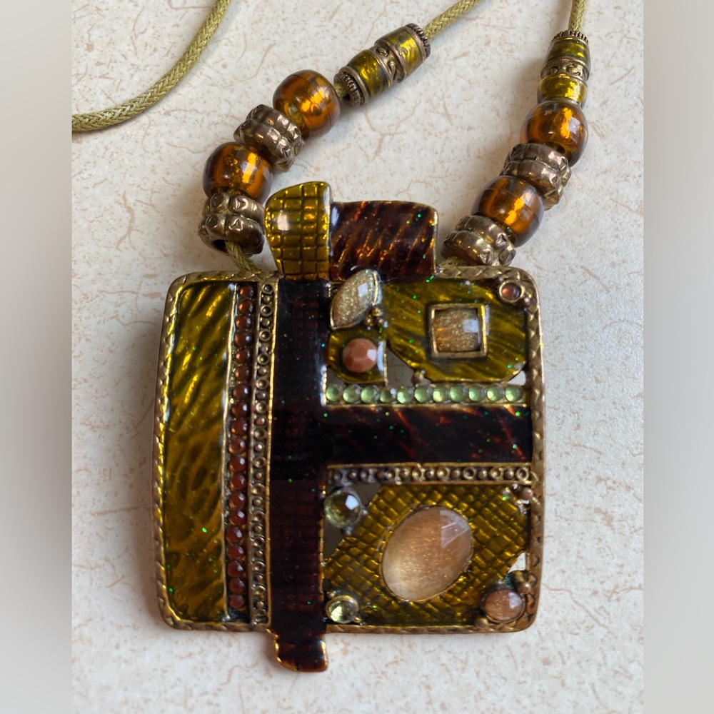 Retro Ikita Brown Red Gold Tone Enamel Pendant on a cord
Necklace